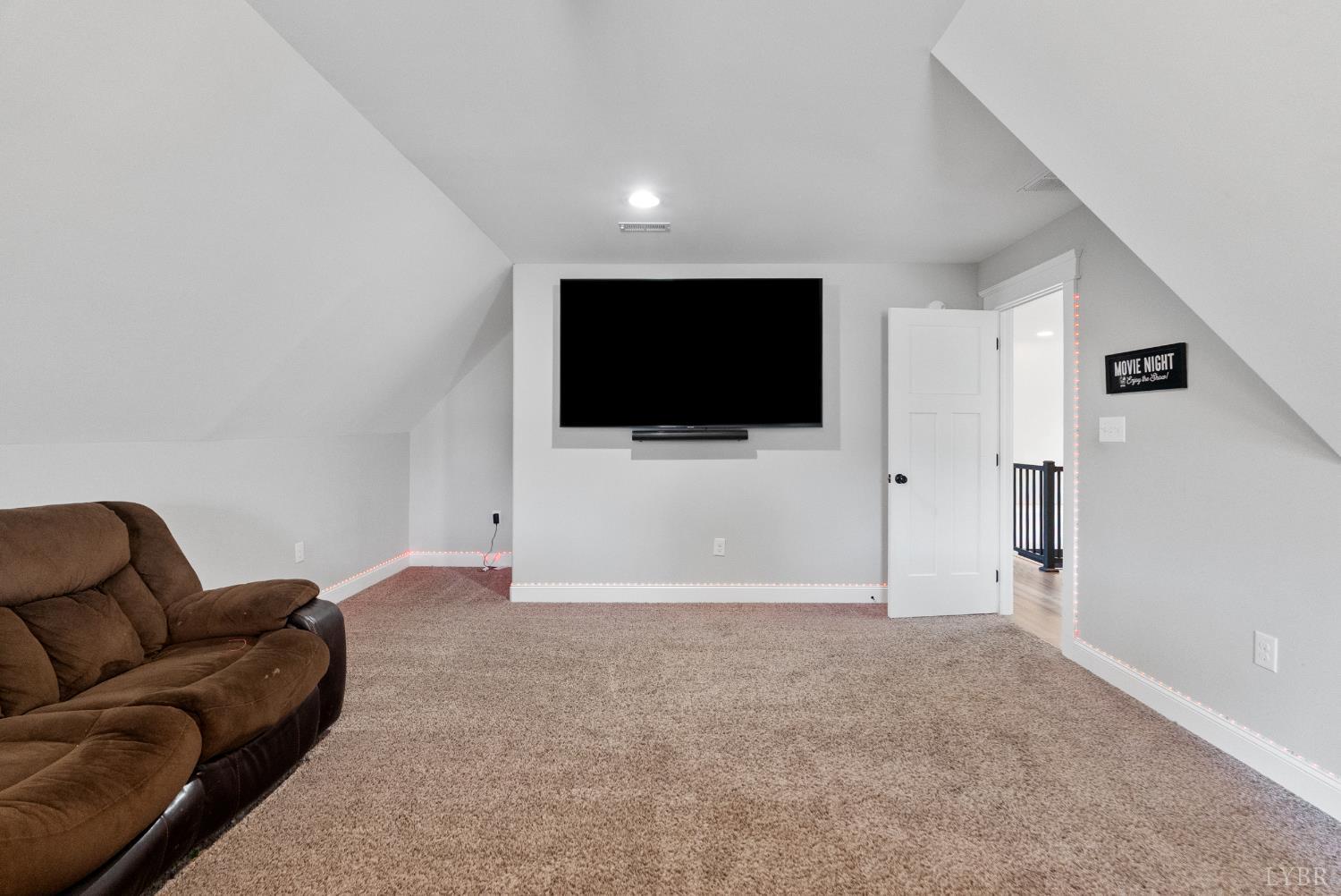 835 Sunset Ridge Drive Concord, VA 24538 - Photo 35 of 57 a living room with furniture and a flat screen tv