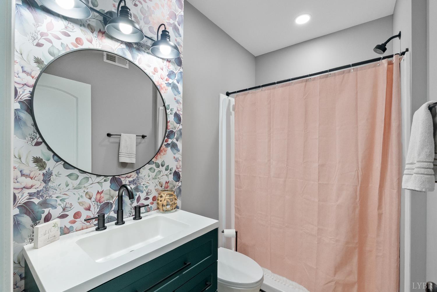 835 Sunset Ridge Drive Concord, VA 24538 - Photo 47 of 57 a bathroom with a sink mirror vanity and toilet
