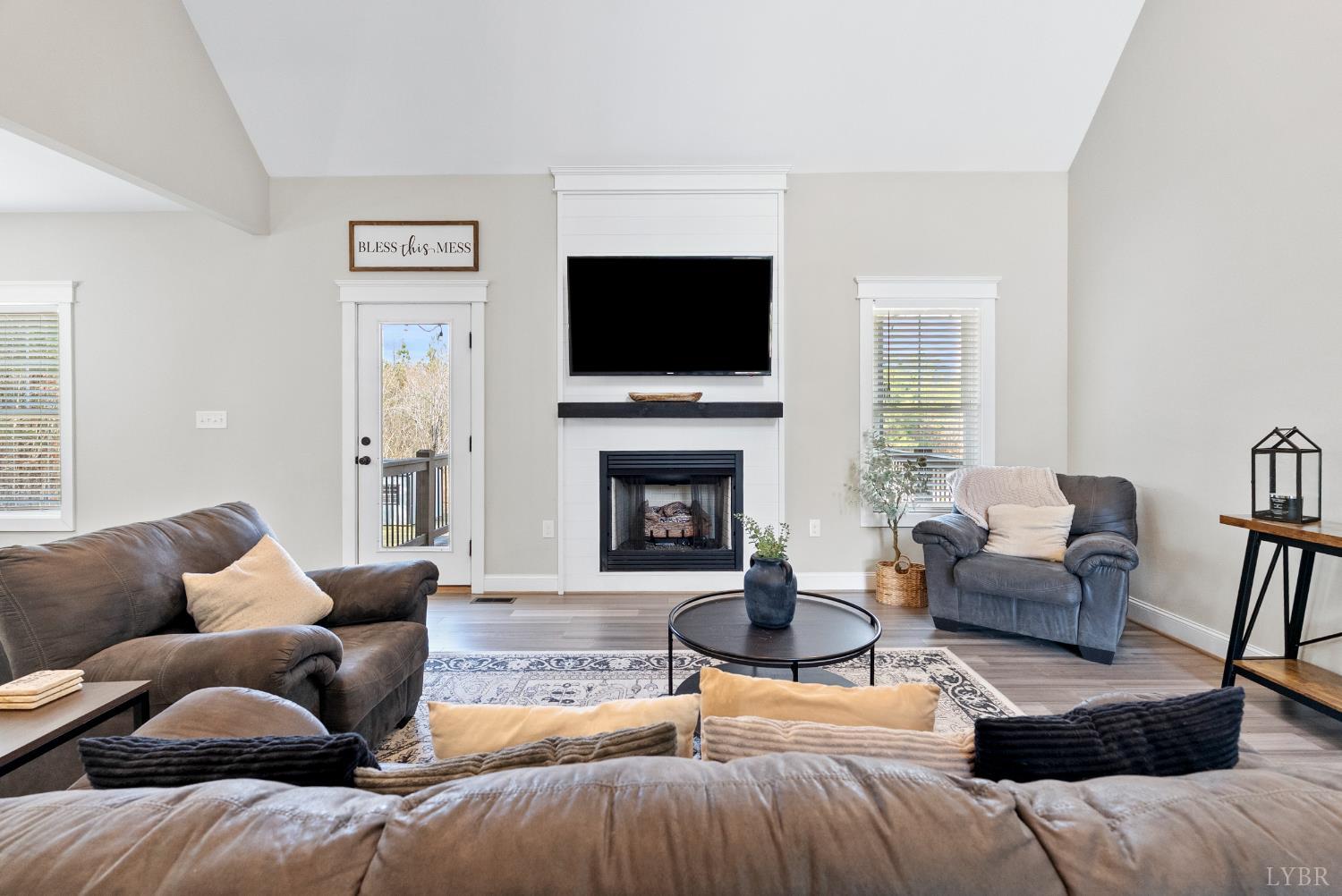 835 Sunset Ridge Drive Concord, VA 24538 - Photo 8 of 57 a living room with furniture or flat screen tv and a fireplace