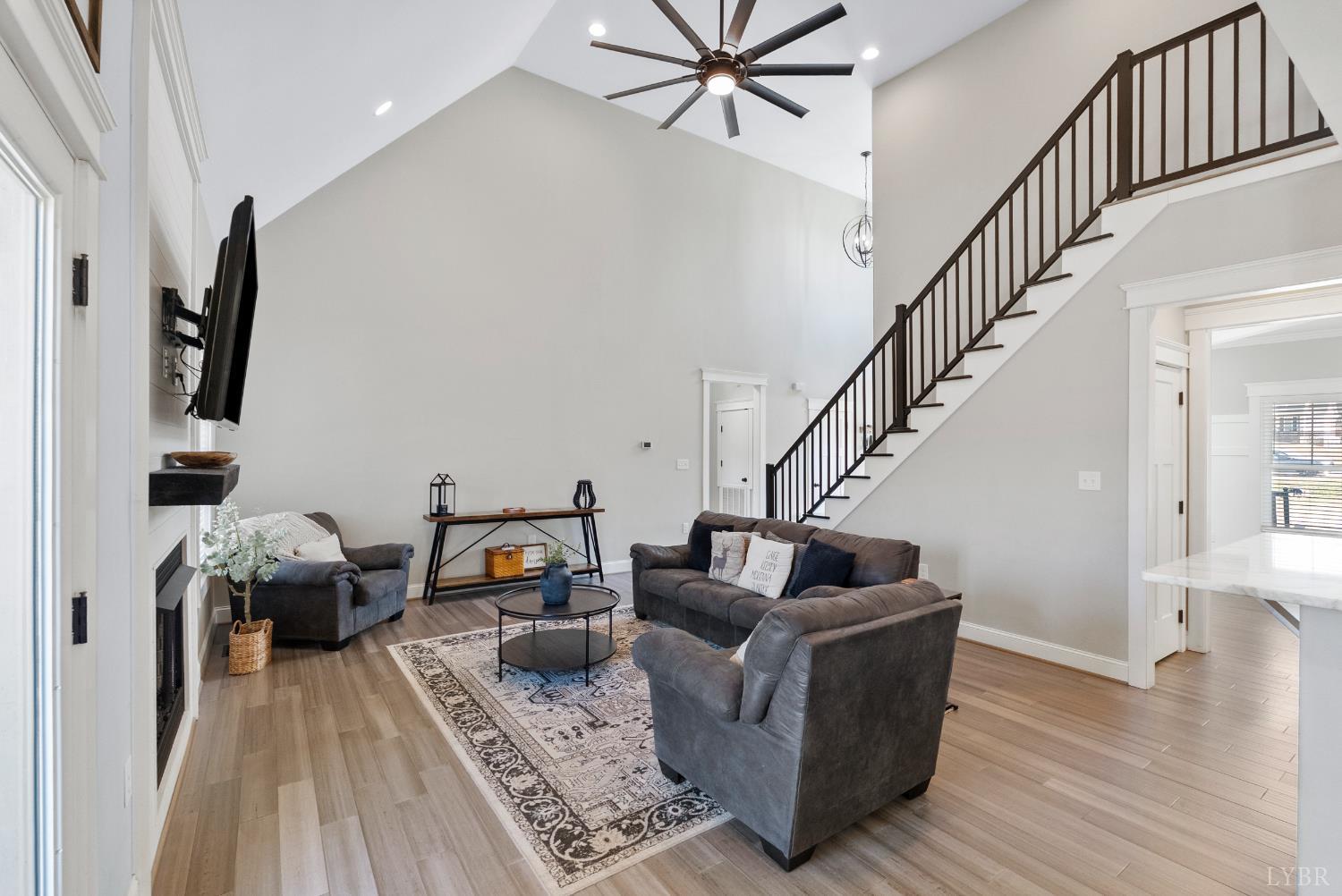 835 Sunset Ridge Drive Concord, VA 24538 - Photo 9 of 57 a living room with furniture and a wooden floor