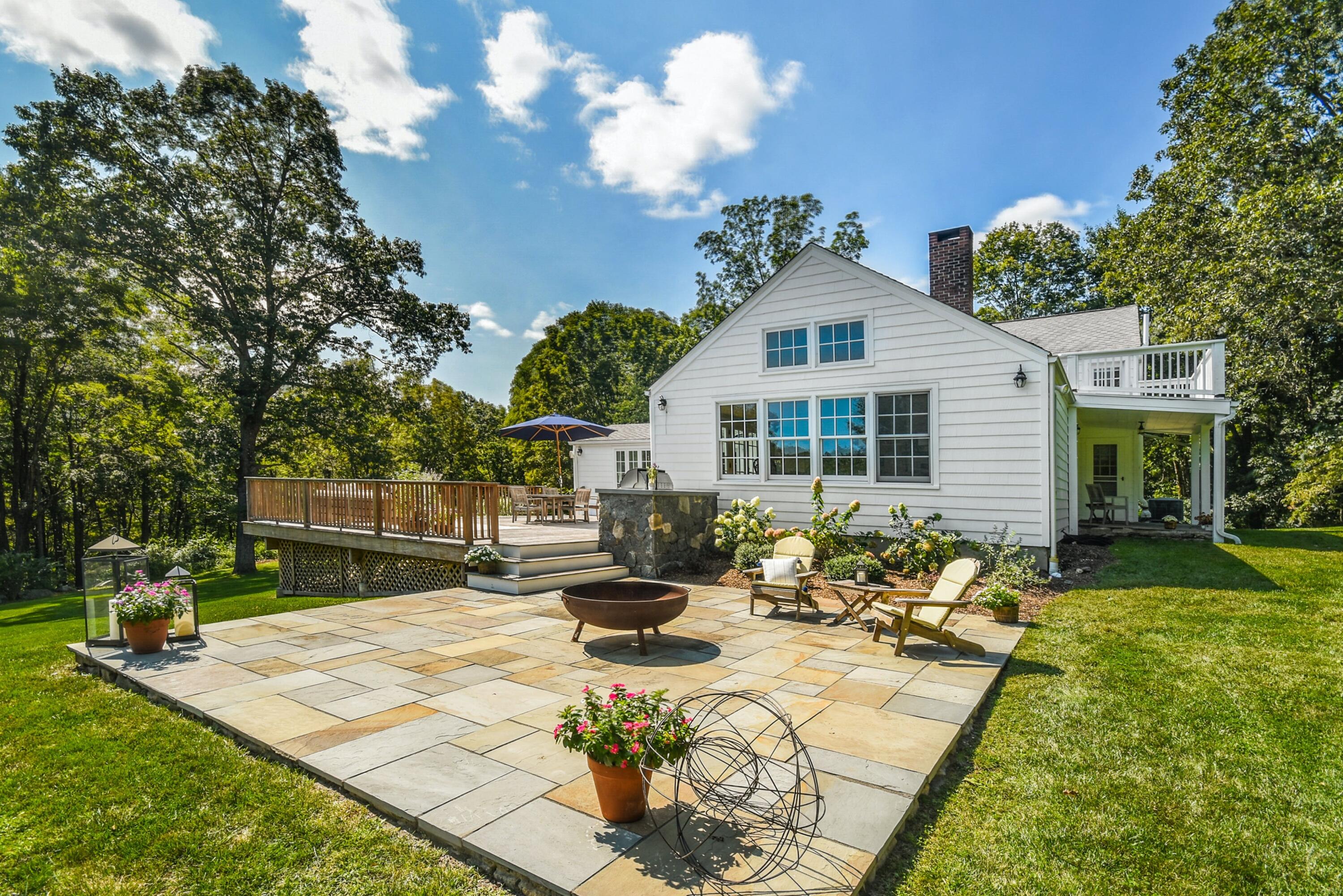 214 Millstone Road Wilton, CT 06897 - Photo 3 of 32 a view of a house with swimming pool and sitting area