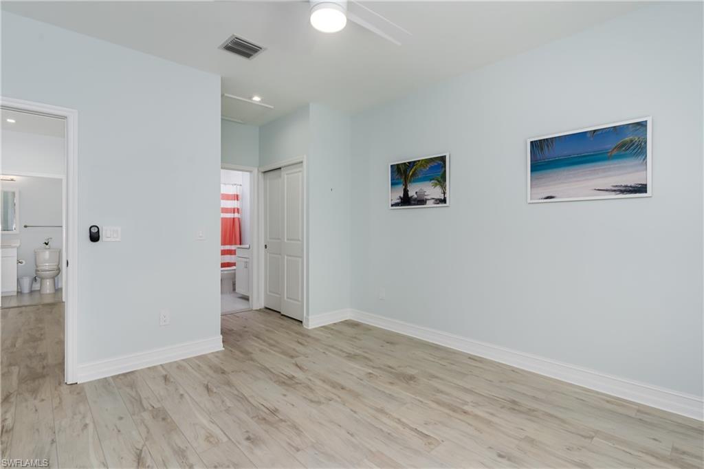 7336 Rockefeller Drive Naples, FL 34119 - Photo 18 of 50 wooden floor in an empty room