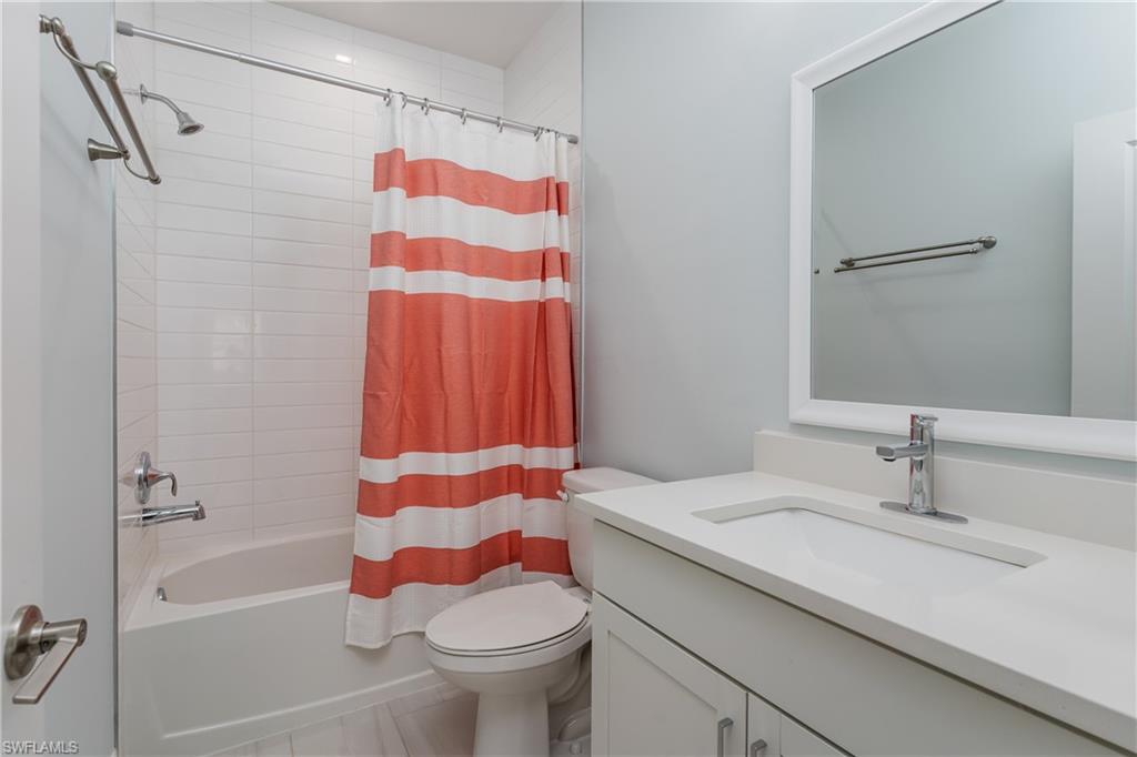 7336 Rockefeller Drive Naples, FL 34119 - Photo 19 of 50 a bathroom with a sink toilet and shower
