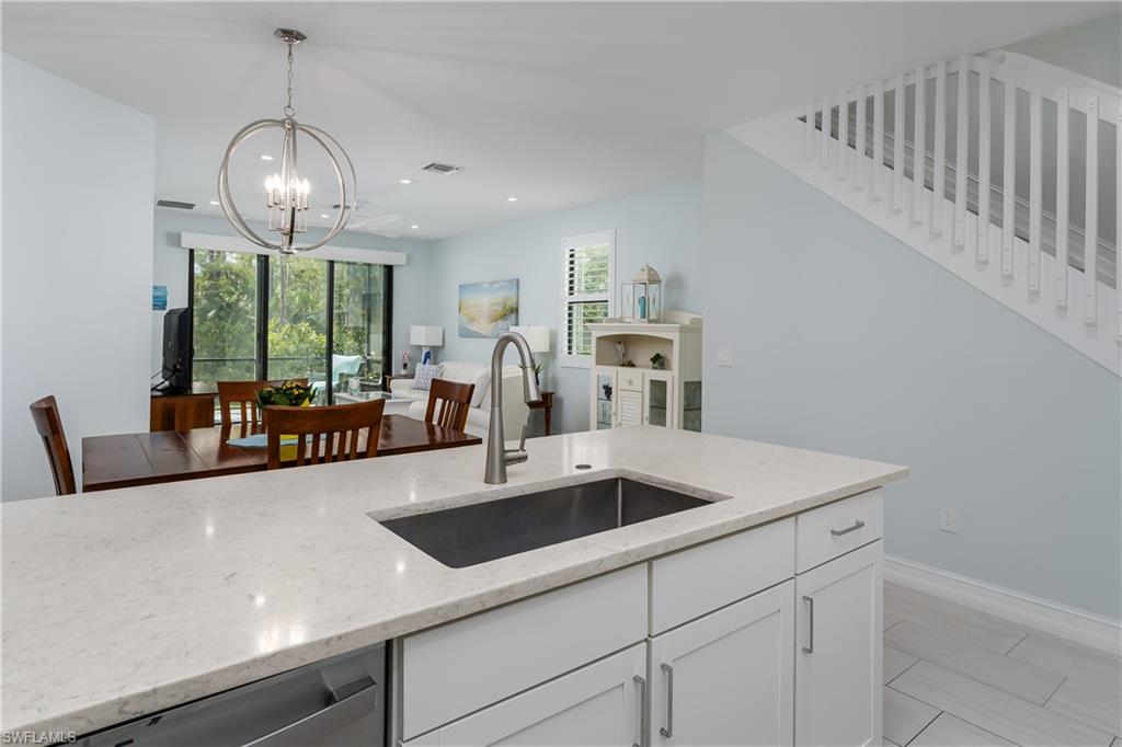 7336 Rockefeller Drive Naples, FL 34119 - Photo 2 of 50 a view of living room with granite countertop furniture