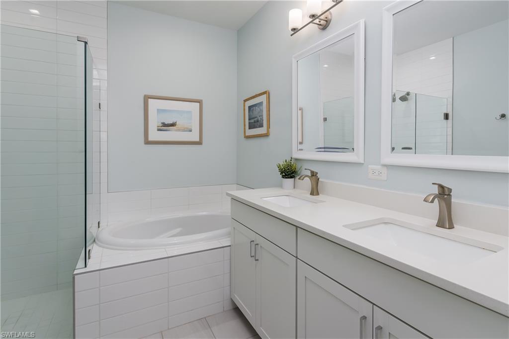 7336 Rockefeller Drive Naples, FL 34119 - Photo 26 of 50 a bathroom with a sink and a bathtub