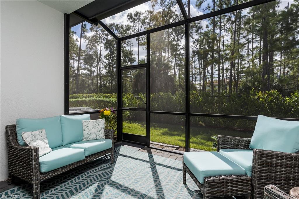7336 Rockefeller Drive Naples, FL 34119 - Photo 29 of 50 a outdoor living space with patio and a couch