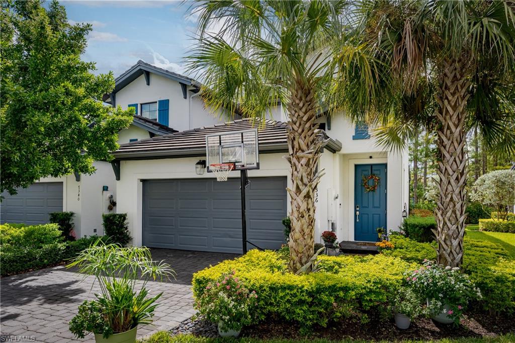 7336 Rockefeller Drive Naples, FL 34119 - Photo 32 of 50 a front view of a house with a yard