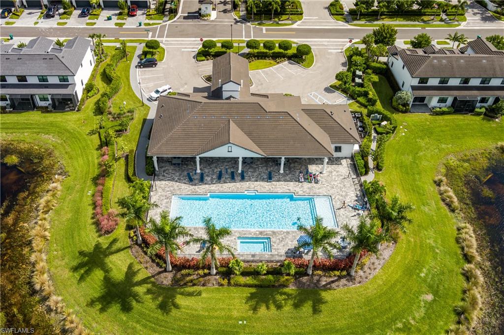 7336 Rockefeller Drive Naples, FL 34119 - Photo 37 of 50 an aerial view of a house with a garden and lake view