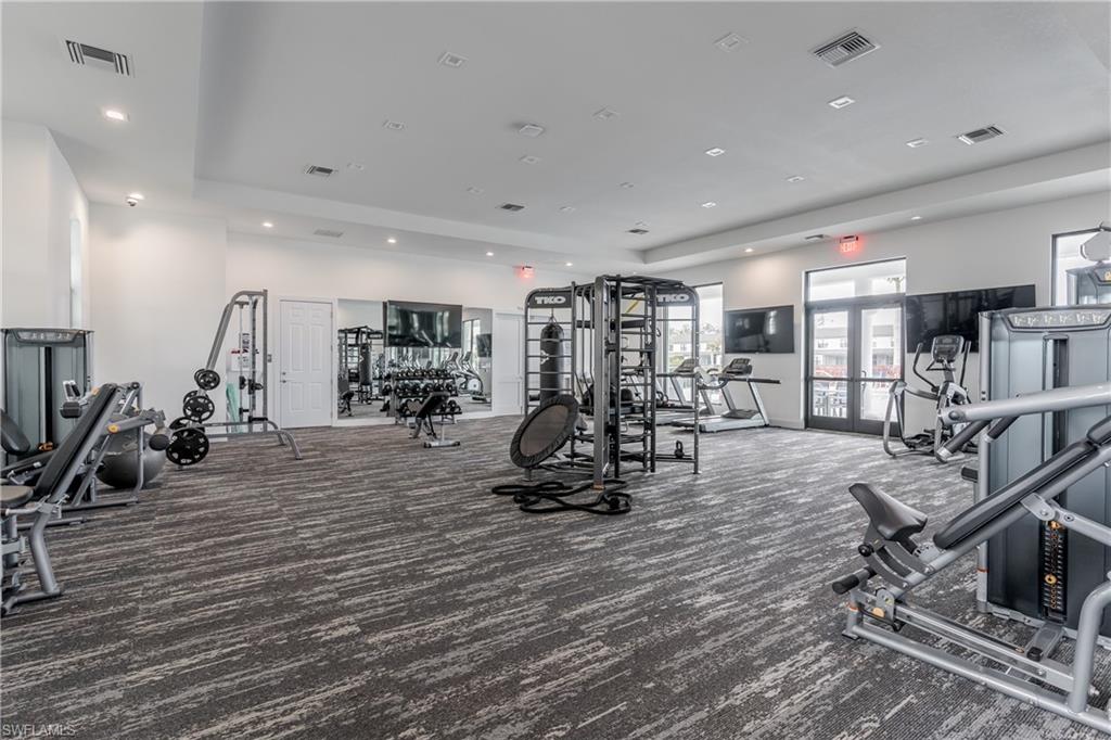 7336 Rockefeller Drive Naples, FL 34119 - Photo 39 of 50 a view of a room with gym equipment