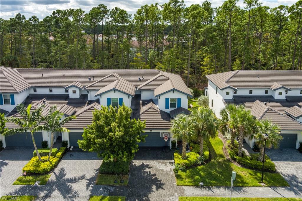 7336 Rockefeller Drive Naples, FL 34119 - Photo 40 of 50 an aerial view of multiple houses with yard