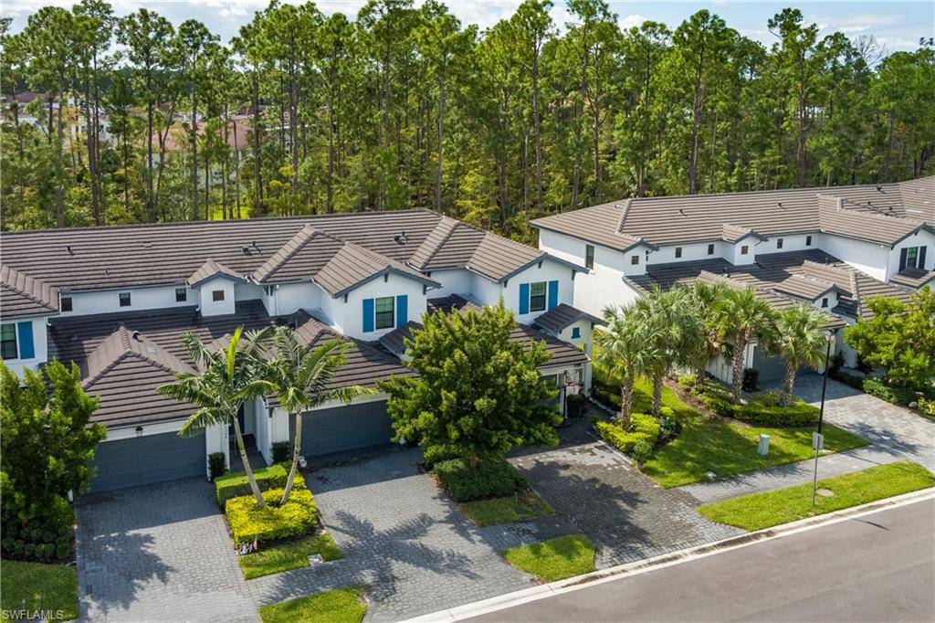 7336 Rockefeller Drive Naples, FL 34119 - Photo 42 of 50 an aerial view of multiple houses with yard
