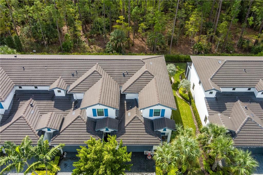 7336 Rockefeller Drive Naples, FL 34119 - Photo 43 of 50 an aerial view of a house with a yard