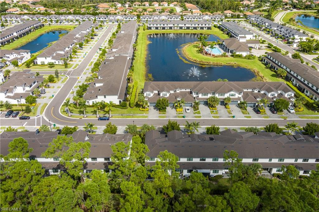 7336 Rockefeller Drive Naples, FL 34119 - Photo 44 of 50 an aerial view of a city with houses
