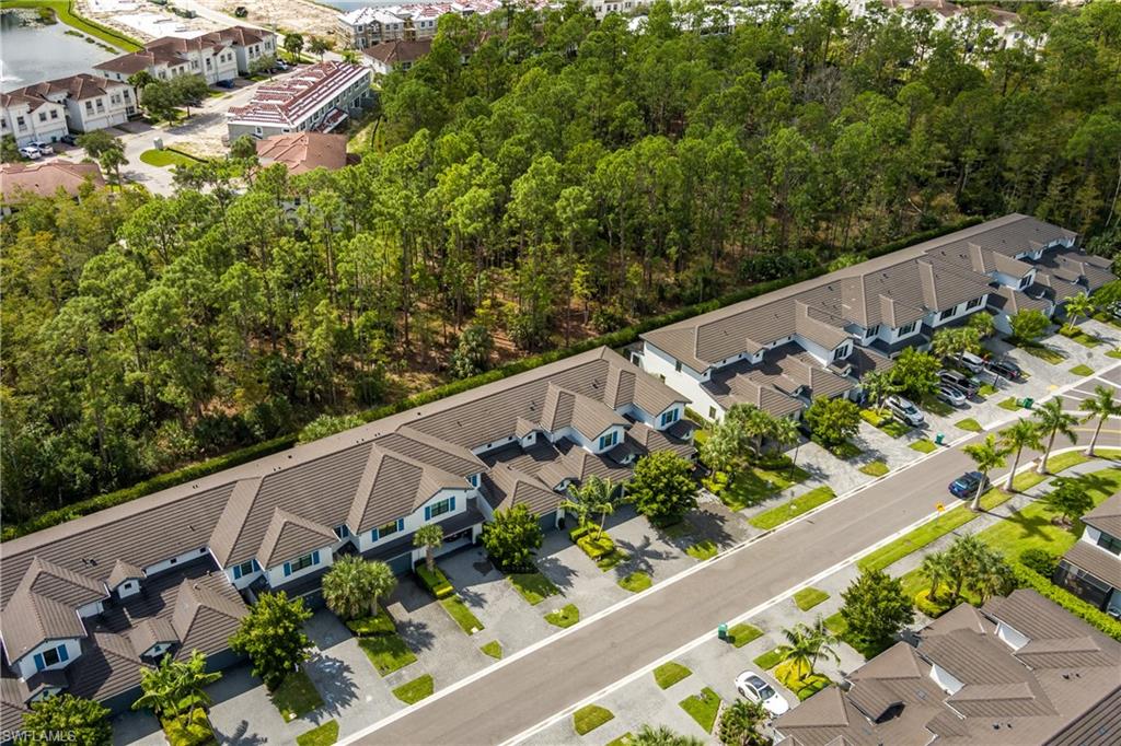 7336 Rockefeller Drive Naples, FL 34119 - Photo 45 of 50 a view of a garden with lawn chairs
