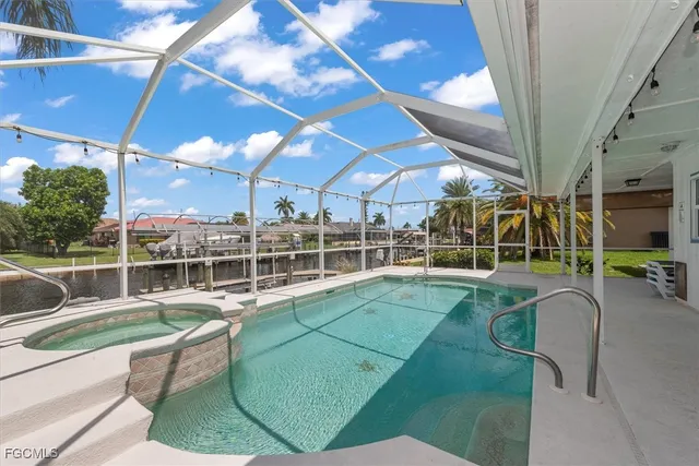 a view of a swimming pool with seating space