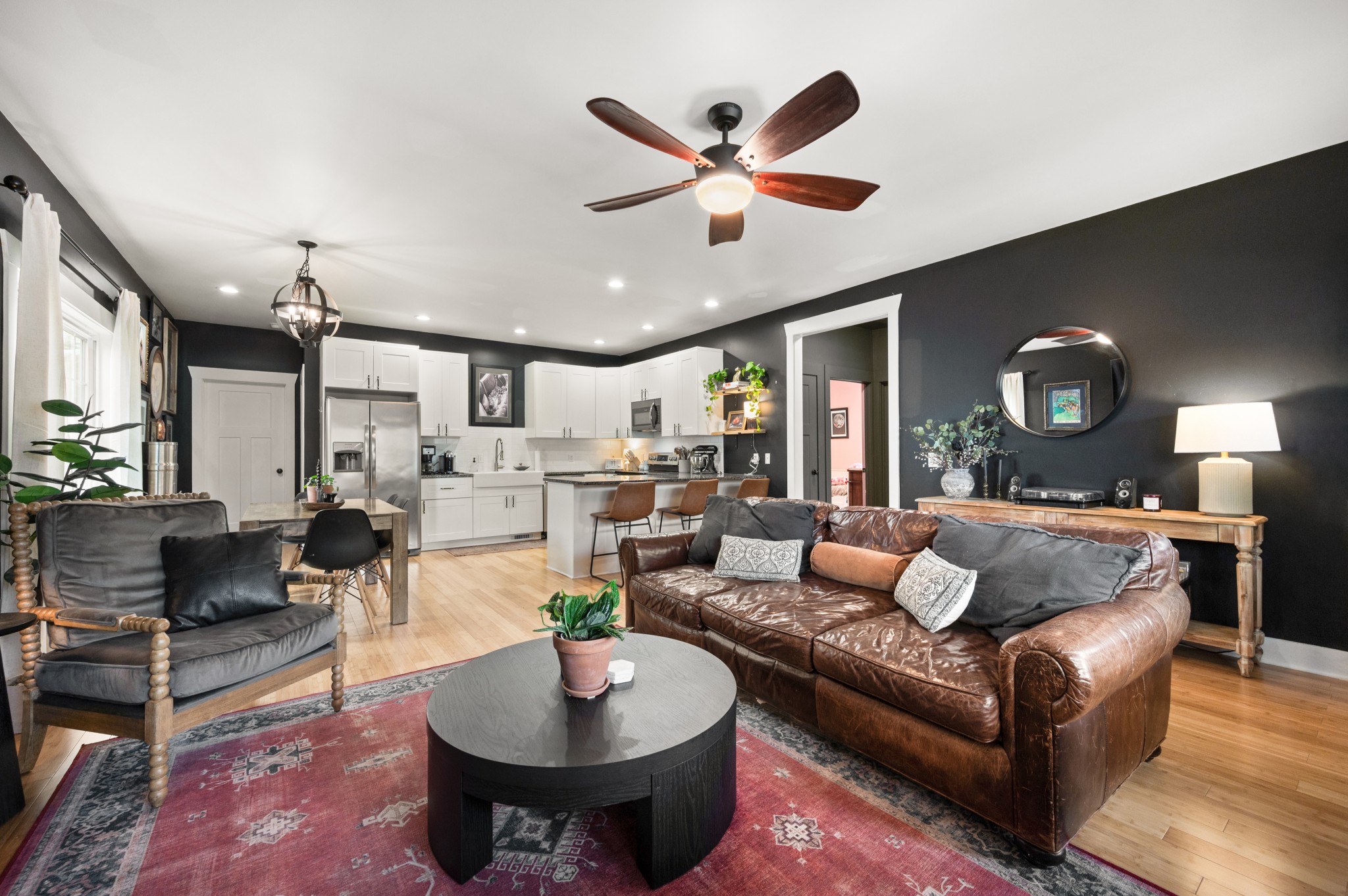 108 Poplar Street Dickson, TN 37055 - Photo 11 of 39 a living room with furniture kitchen view and a chandelier