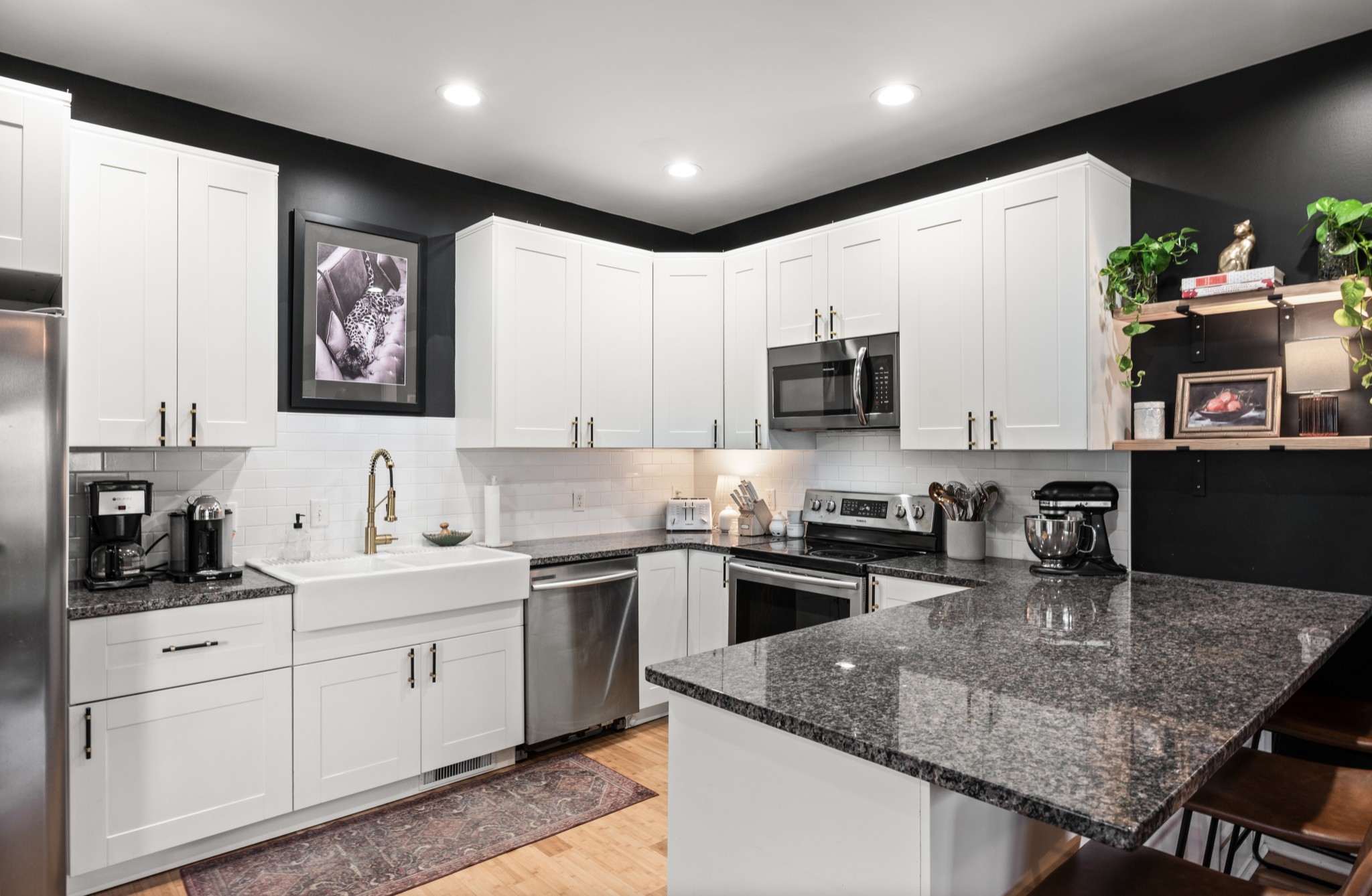 108 Poplar Street Dickson, TN 37055 - Photo 17 of 39 a kitchen with stainless steel appliances granite countertop a sink dishwasher stove and refrigerator