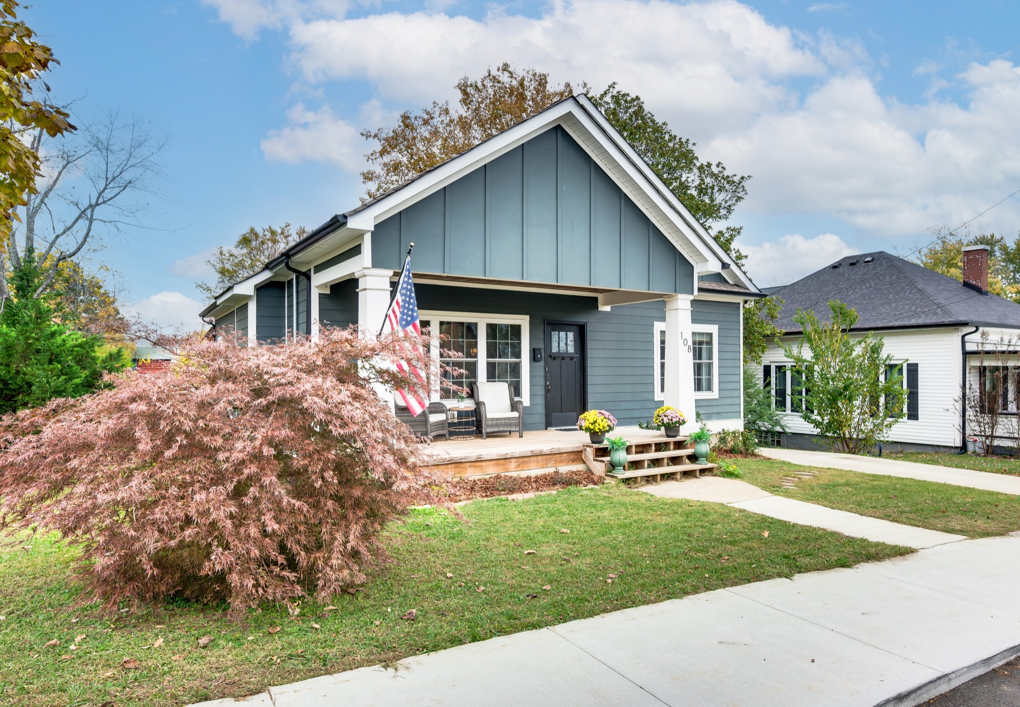 108 Poplar Street Dickson, TN 37055 - Photo 3 of 39 a front view of house with a garden and patio