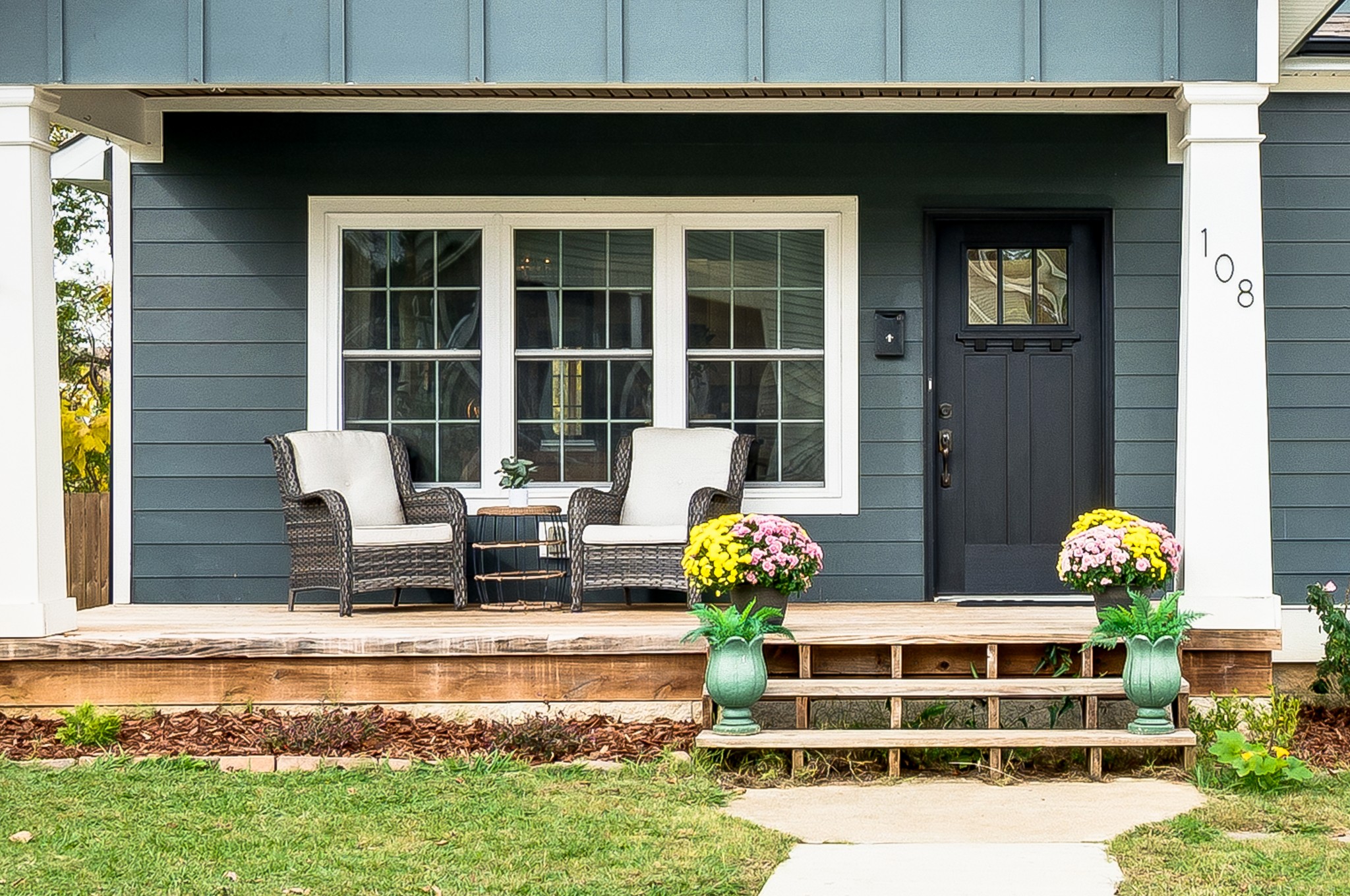 108 Poplar Street Dickson, TN 37055 - Photo 5 of 39 a front view of a house with a garden