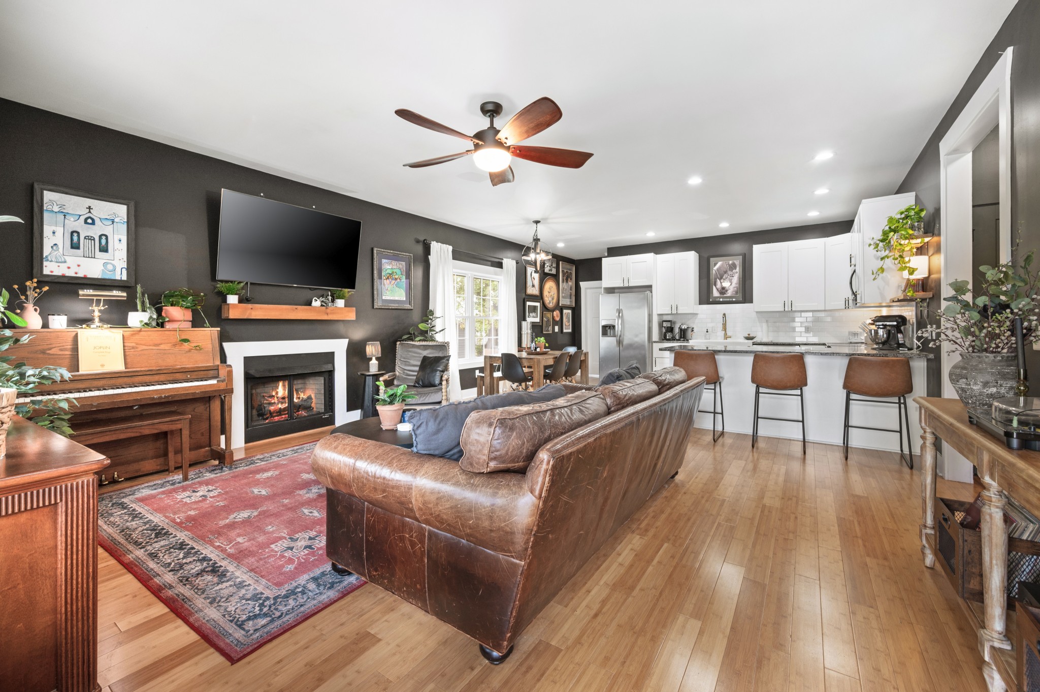 108 Poplar Street Dickson, TN 37055 - Photo 9 of 39 a living room with furniture a flat screen tv and a fireplace