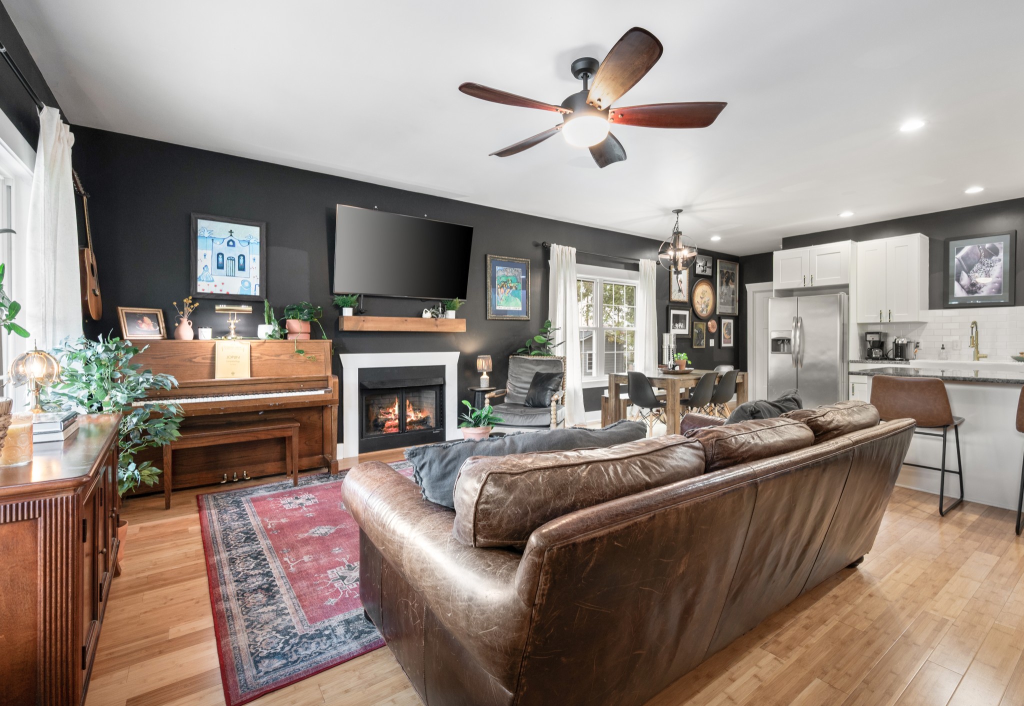 108 Poplar Street Dickson, TN 37055 - Photo 10 of 39 a living room with furniture a fireplace and a flat screen tv