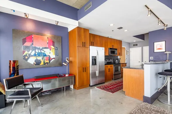 a living room with furniture and a rug