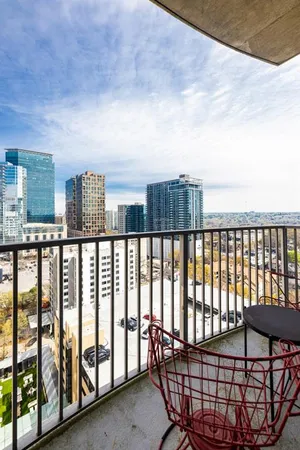a view of a balcony with outdoor seating