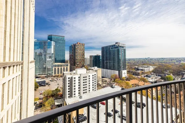 a view of a balcony with city view