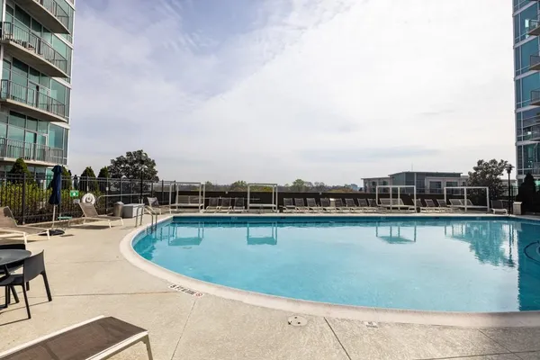 a view of a swimming pool with a lounge chair