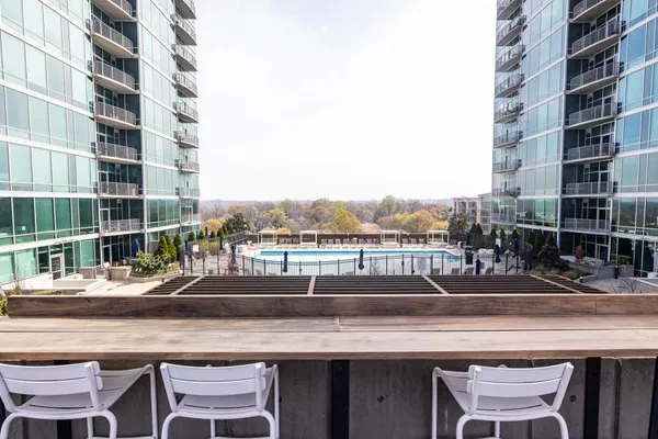 a view of swimming pool with outdoor seating