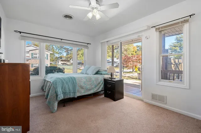 a bedroom with a bed and flat screen tv