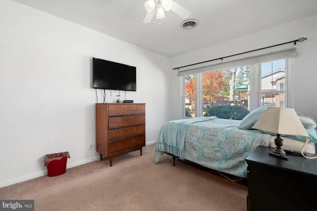 a bedroom with a bed and dresser