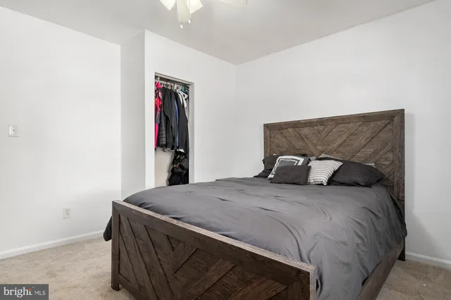 a bathroom with a toilet sink and window