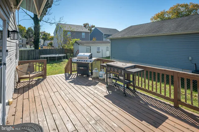 a view of balcony with wooden floor and outdoor seating