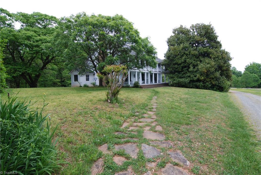 1036 Covington House Road Walnut Cove, NC 27052 - Photo 2 of 29 Stone pathway leading to the front door. Stone work is thought to be original to the home.