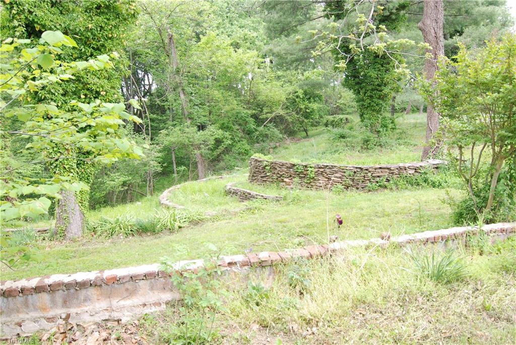 1036 Covington House Road Walnut Cove, NC 27052 - Photo 11 of 29 Another view of the back yard. Notice the beautiful stone work - thought to be original to the home.