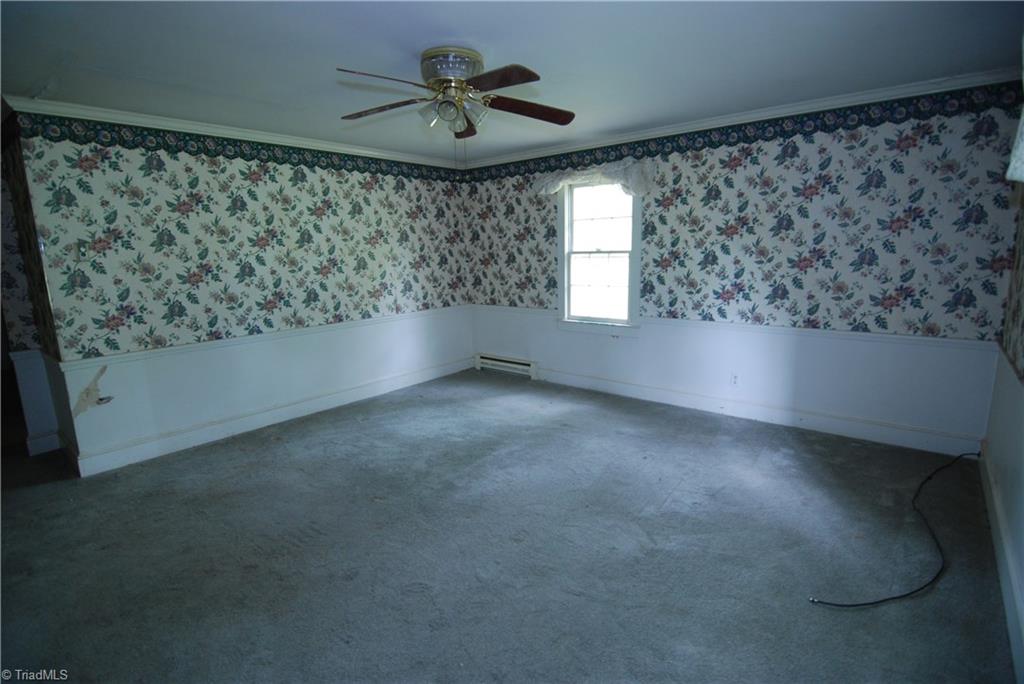 1036 Covington House Road Walnut Cove, NC 27052 - Photo 20 of 29 Large room located at the rear of the home directly off from the parlor on the main level. The previous owners used this room as a downstairs master bedroom.