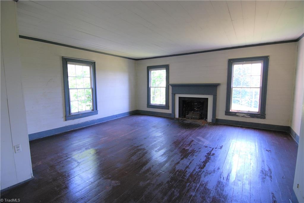 1036 Covington House Road Walnut Cove, NC 27052 - Photo 24 of 29 Another upstairs bedroom. It also has a door that leads to the front porch.