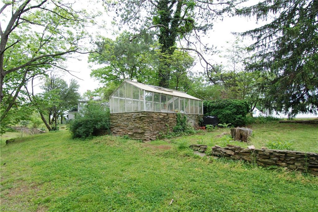 1036 Covington House Road Walnut Cove, NC 27052 - Photo 10 of 29 Greenhouse-with minor repairs will make an inviting area to pot flowers and work in.