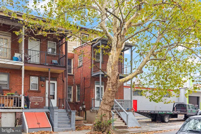 a view of a building with a tree