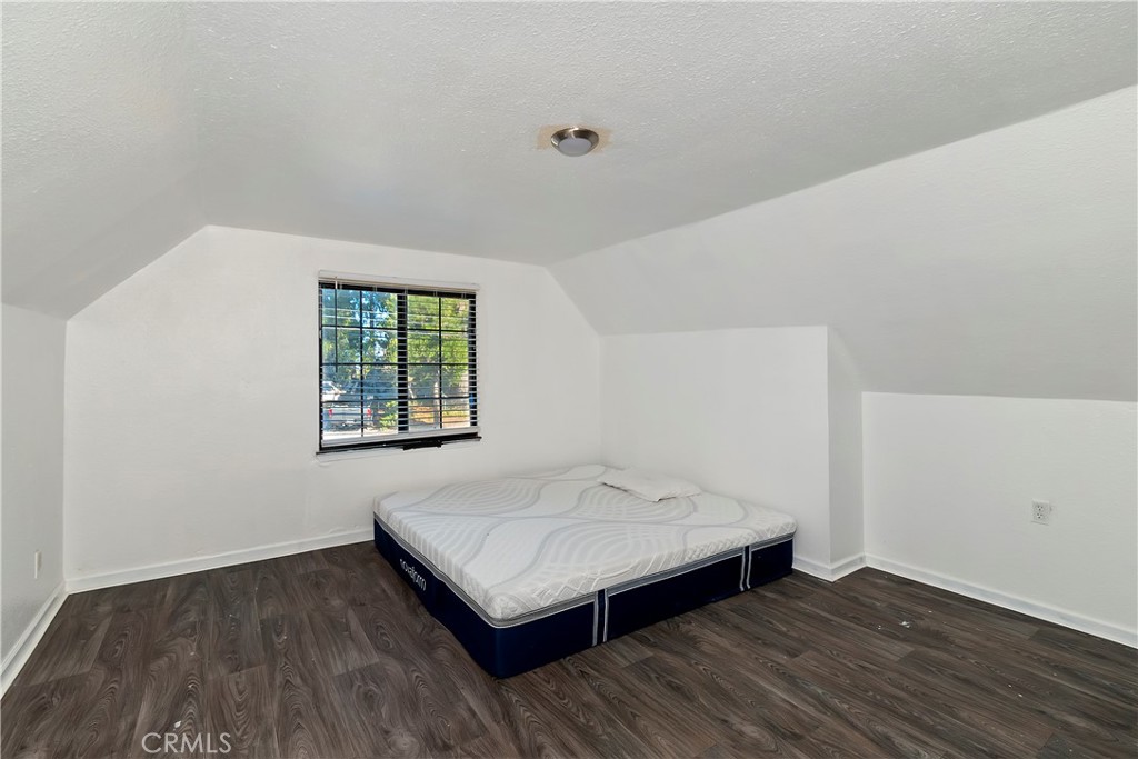 26331 Alpine Lane Twin Peaks, CA 92391 - Photo 23 of 41 wooden floor in an empty room with a window