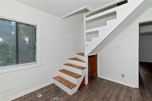 a view of entryway with stairs and wooden floor