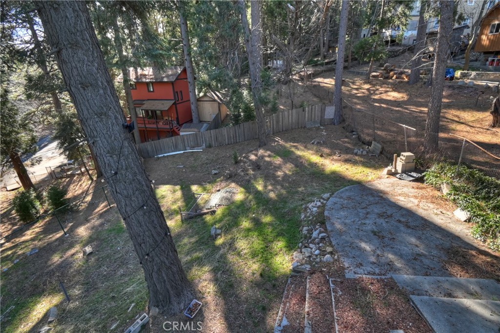 26331 Alpine Lane Twin Peaks, CA 92391 - Photo 28 of 41 a backyard of a house with table and chairs