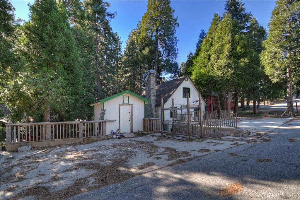 26331 Alpine Lane Twin Peaks, CA 92391 - Photo 38 of 41 a front view of a house with a garden