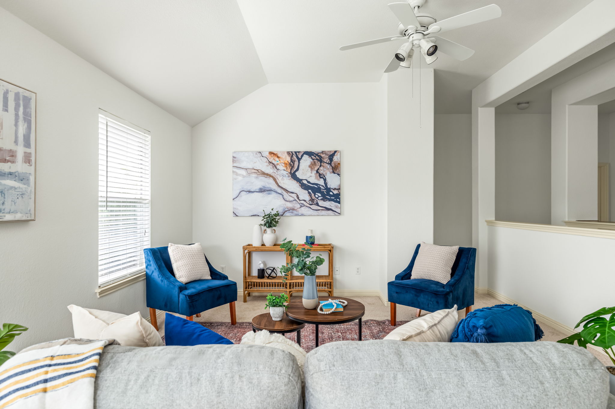 10004 Isle Royale Way Austin, TX 78747 - Photo 16 of 31 Lofty ceilings complement a bright living area, offering a spacious atmosphere for relaxation and gatherings.