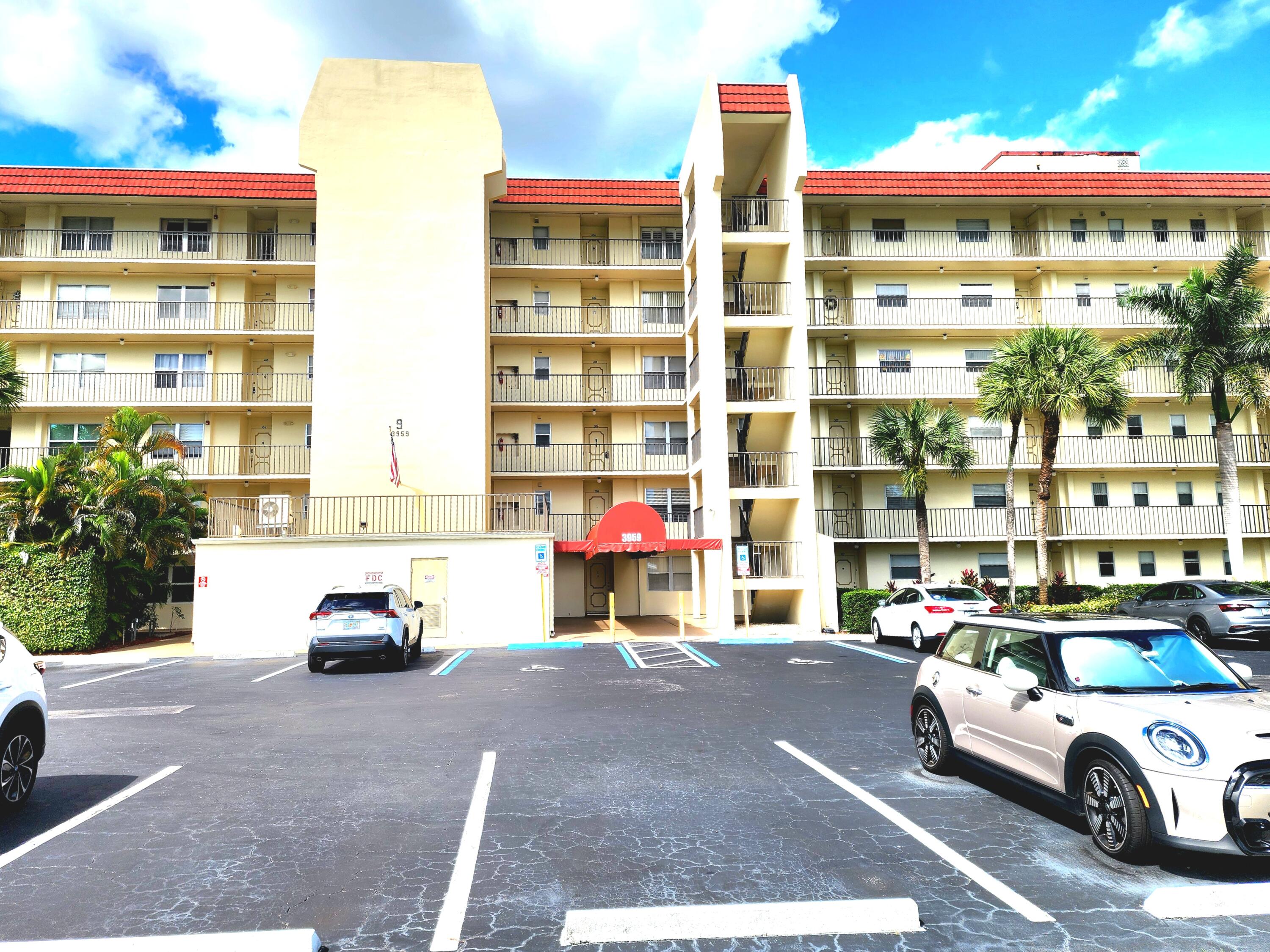 3959 Via Poinciana, Unit 208 Lake Worth, FL 33467 - Photo 2 of 32 FRONT OF BUILDING