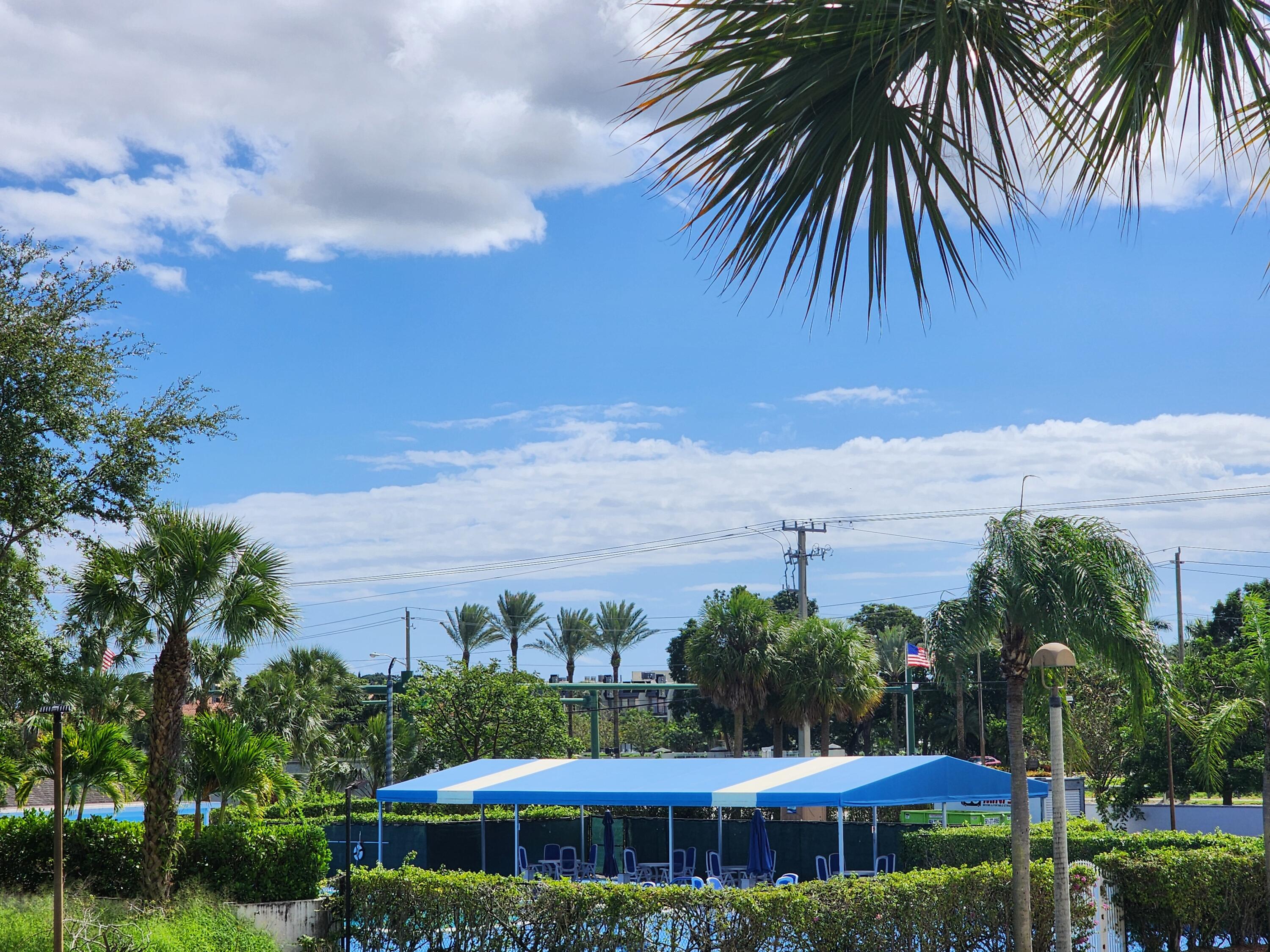 3959 Via Poinciana, Unit 208 Lake Worth, FL 33467 - Photo 30 of 32 POOL AREA