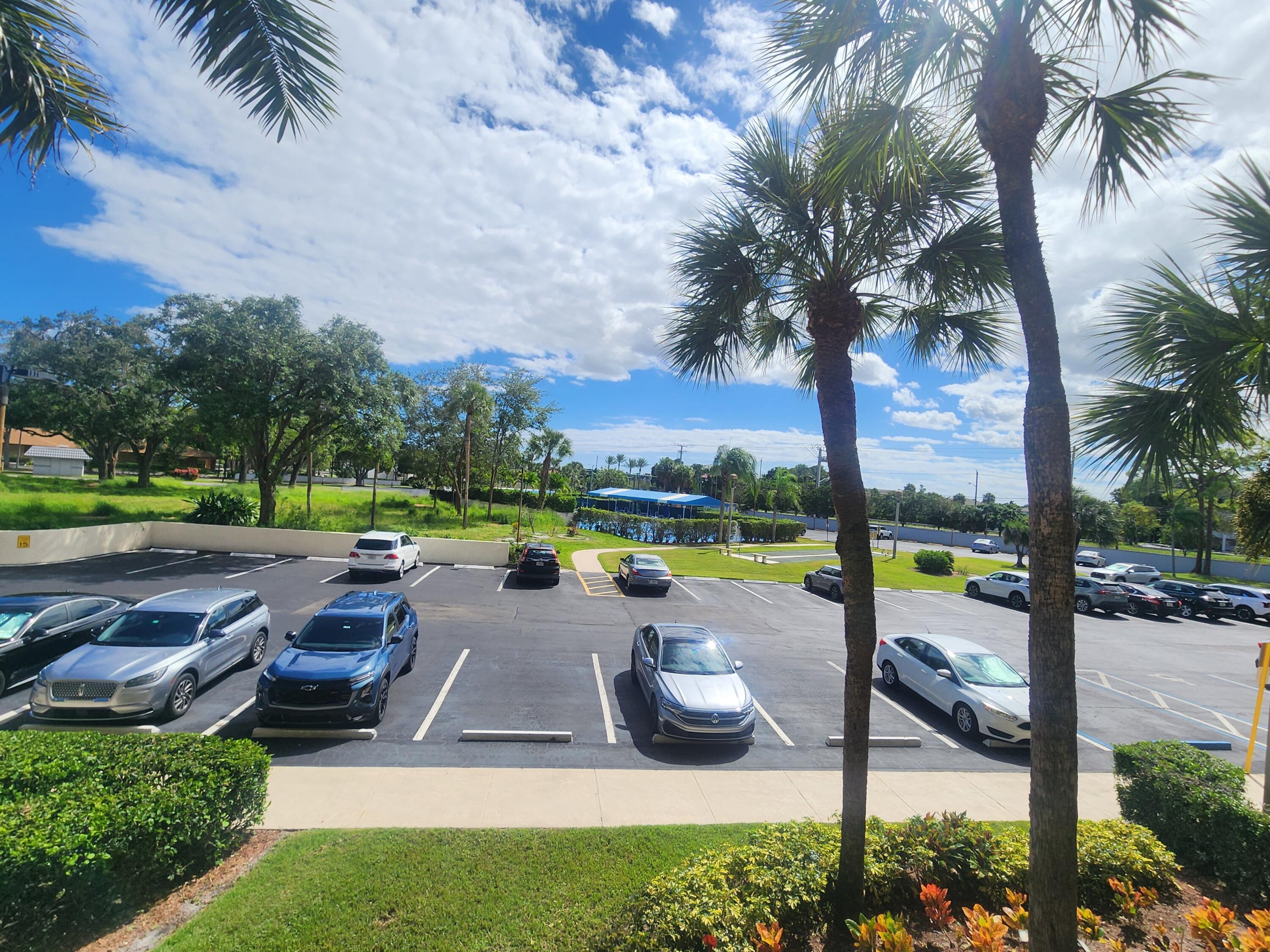 3959 Via Poinciana, Unit 208 Lake Worth, FL 33467 - Photo 31 of 32 PARKING LOT