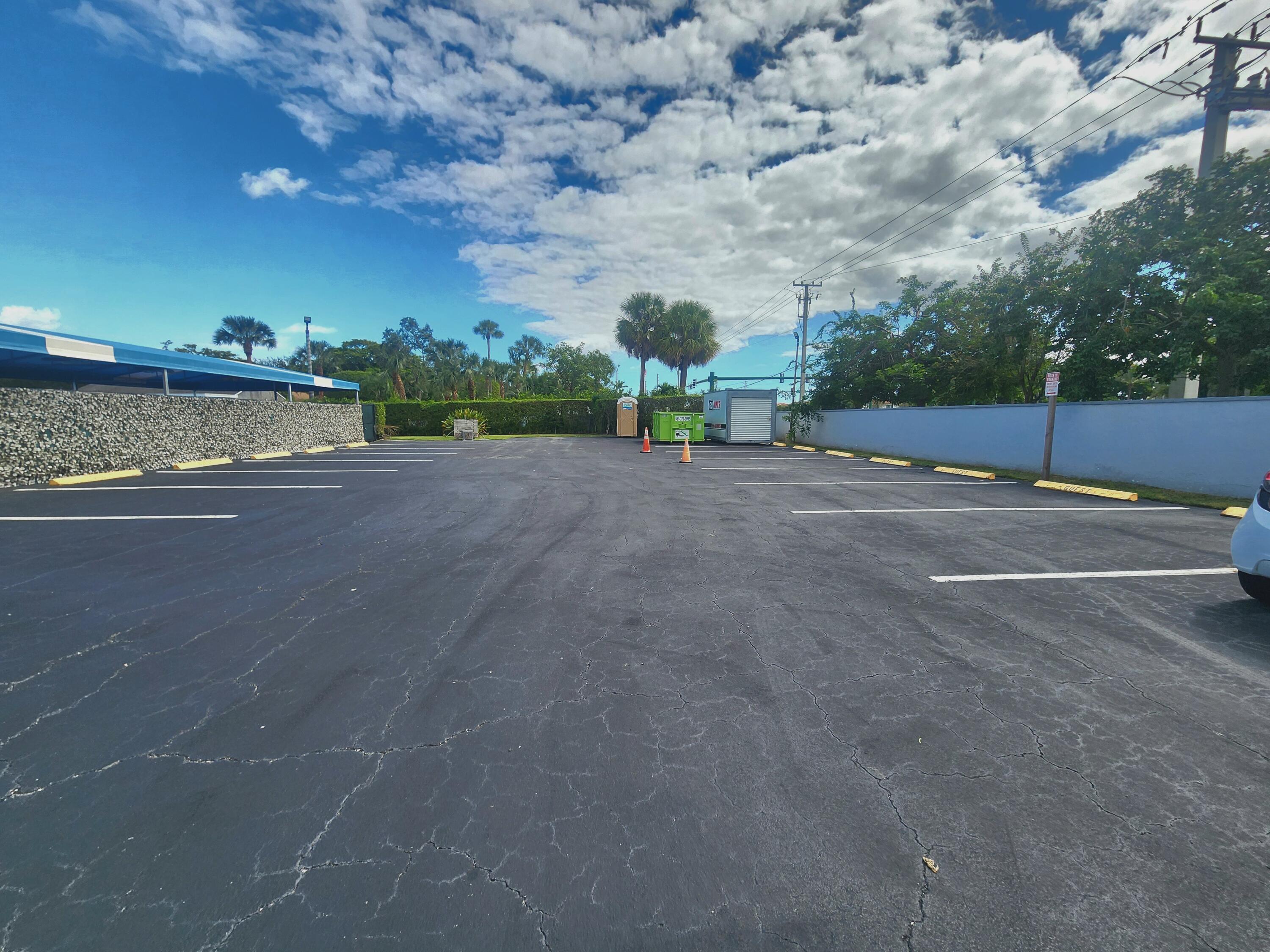 3959 Via Poinciana, Unit 208 Lake Worth, FL 33467 - Photo 32 of 32 GUEST PARKING LOT