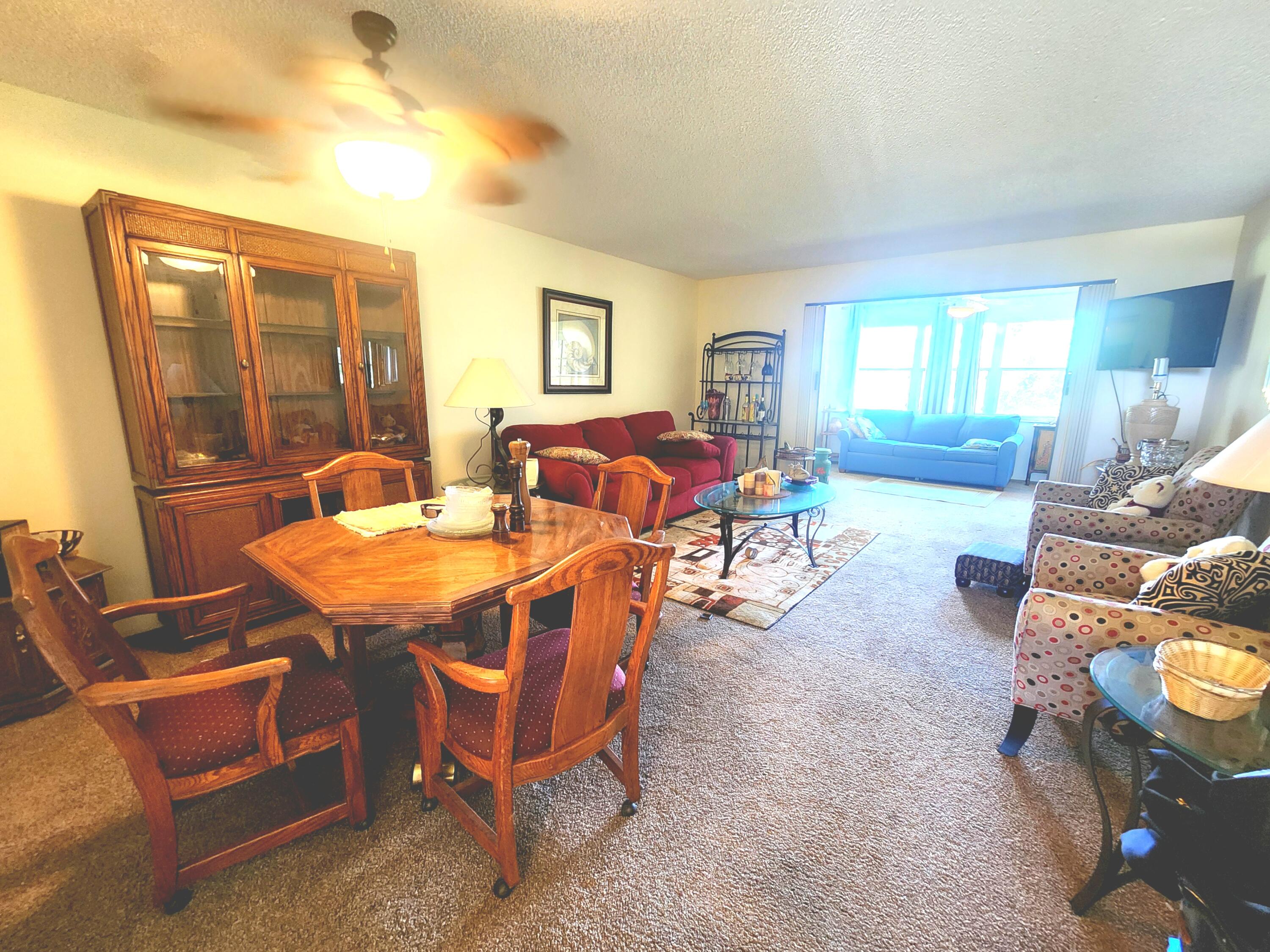 3959 Via Poinciana, Unit 208 Lake Worth, FL 33467 - Photo 8 of 32 LIVING ROOM/dining PIC1